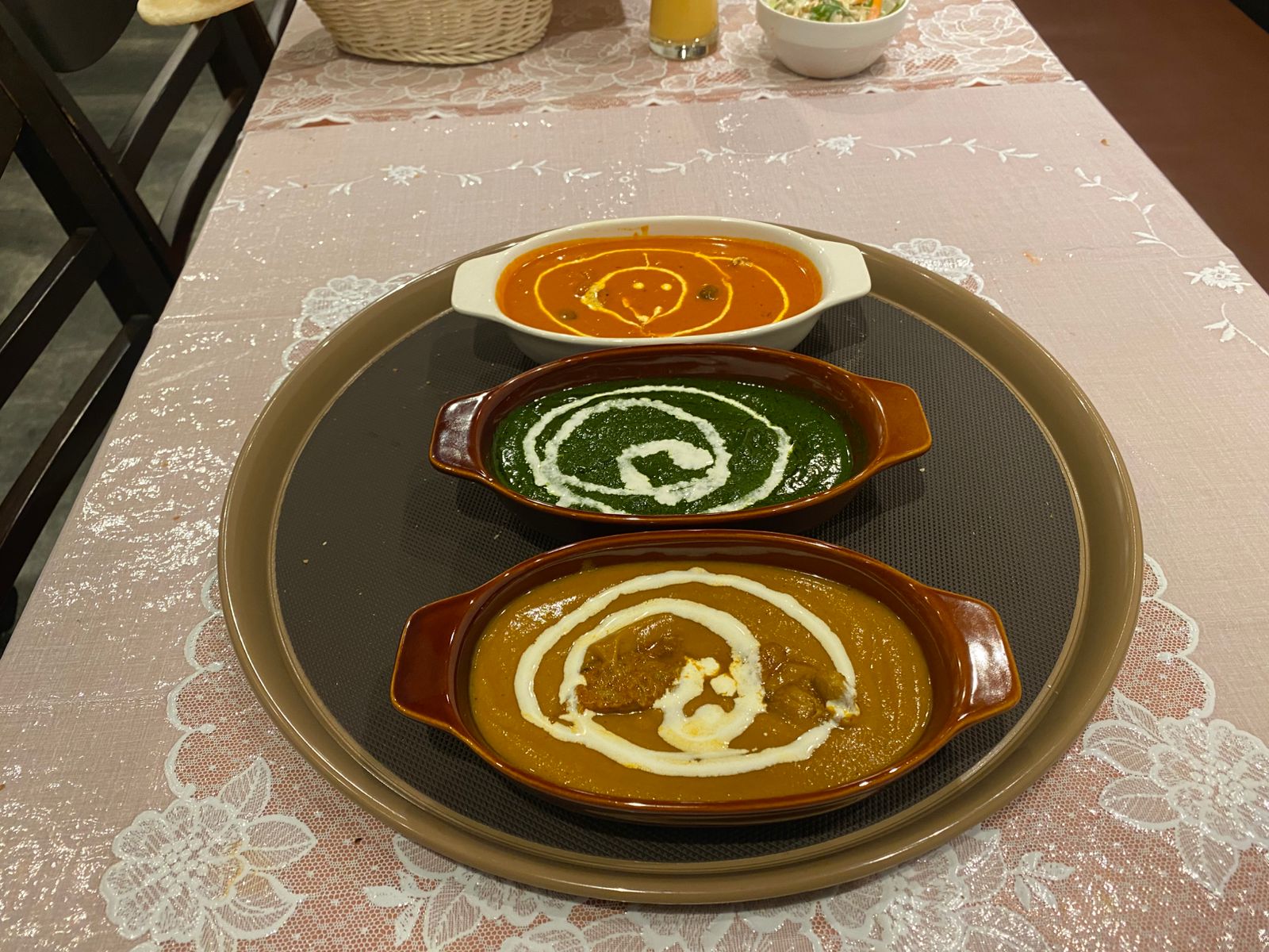 Three curry choices on a tray